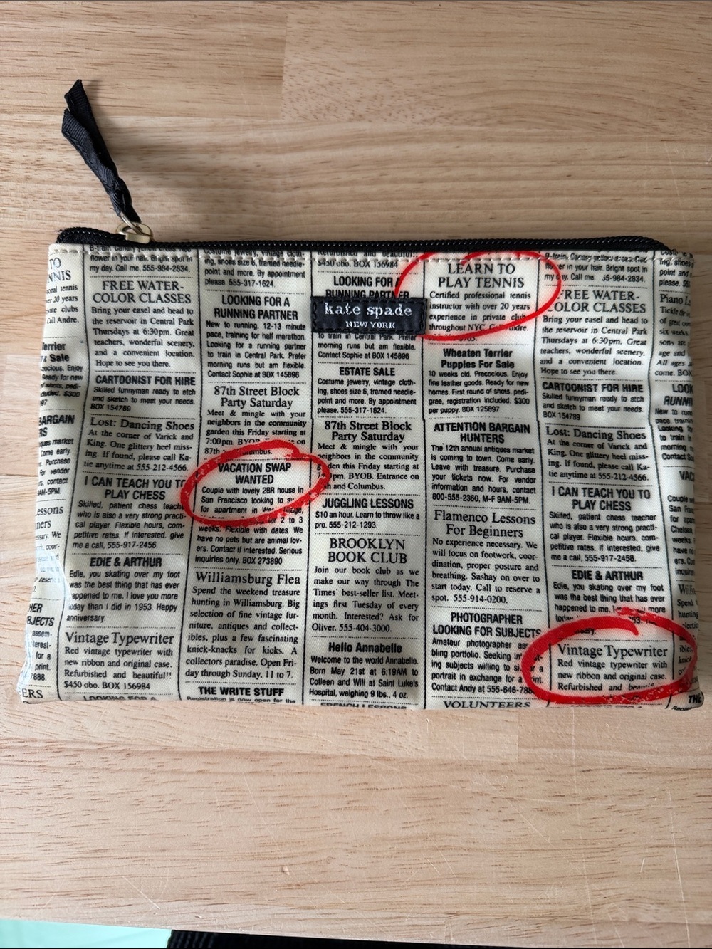 Kate Spade travel pouch. 8x6 inches in size. Classified ads design. Black/white